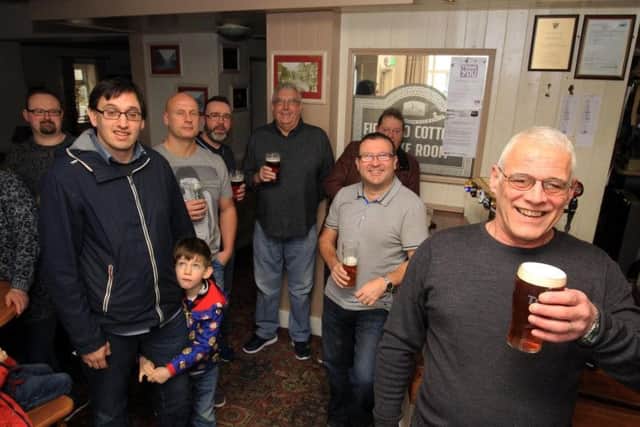 Pub manager Gary Bell with regulars at the Firwood Cottage