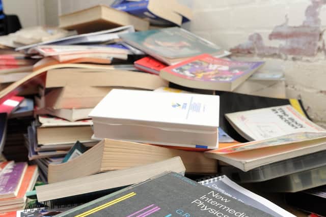 Books piled up ahead of the college's move in 2015.