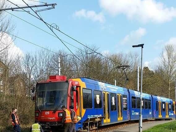 Engineers working on the tram. Picture: Jordan Connor
