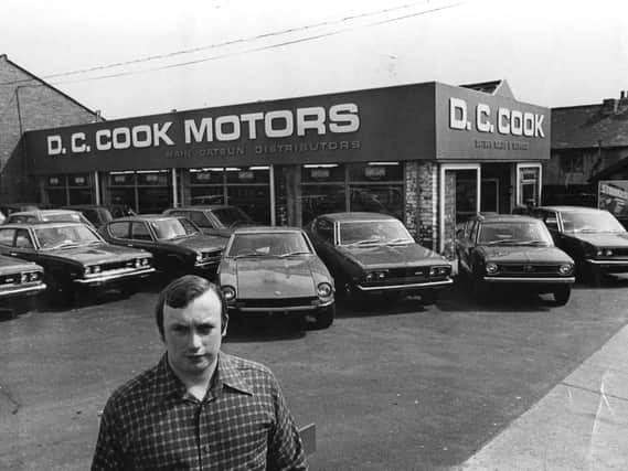 Derek Cook outside one of his garages.