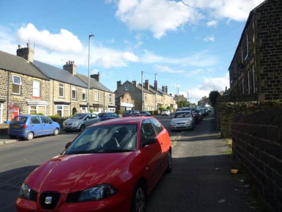 Parked cars along Cross Hill where the pub will be