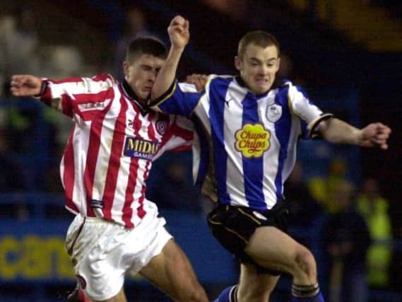 Alan Quinn and Nick Montgomery clash in a past Sheffield derby