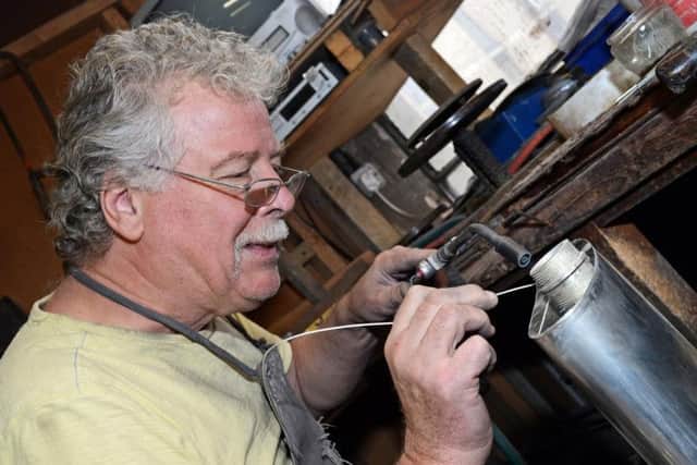 Ray Deakin working on a gallon Pewter Flask. Picture: Marie Caley