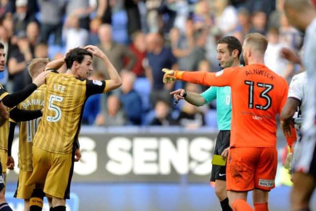 Kieran Lee is shown a yellow card against Bolton for diving