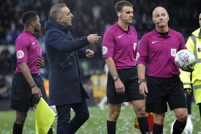 Carlos Carvalhal has a word with referee Scott Duncan