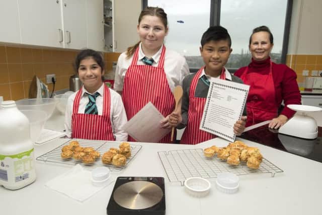 Pupils baking scones in a lesson