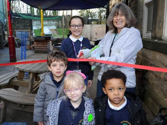 School governor Alison Riocreux with pupils at Woodseats Primary School cut the ribbon to open the new playground