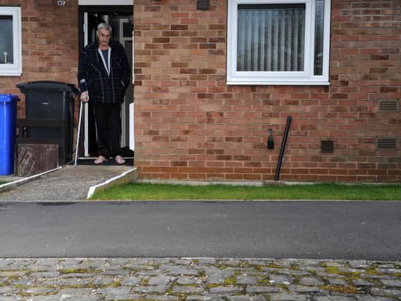 Frank Turner pictured with the pavement outside his bungalow. Picture: Andrew Roe.