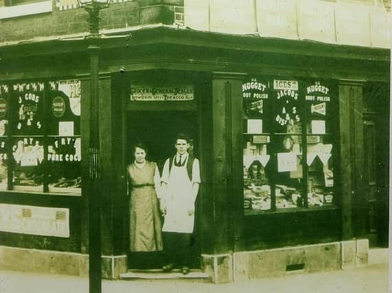 Gladys Smith's father and grandmother outside the family convenience store they ran on the corner of Popple Street and Hinde Street in Page Hall