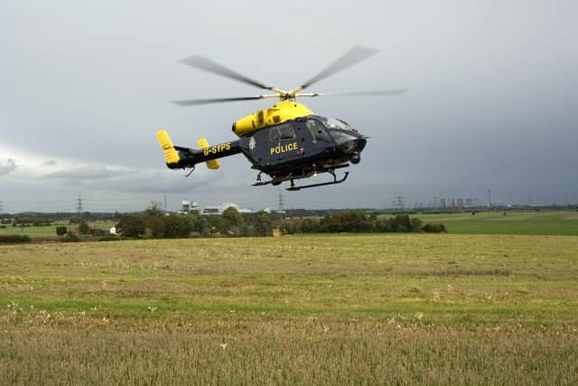 Police helicopter - Credit: SWNS