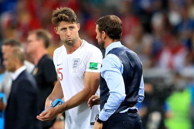 England's Gary Cahill speaks with England manager Gareth Southgate