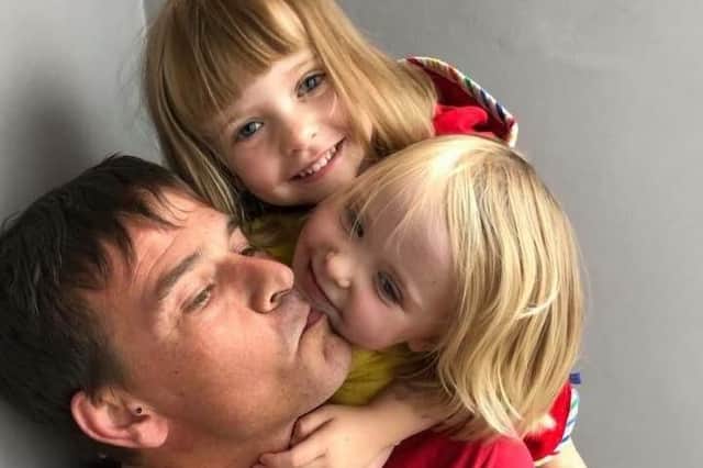 Mark Hart with his two young girls