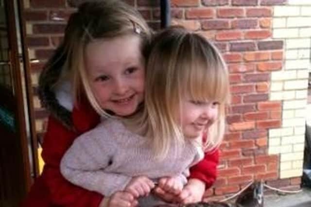 Daisy Montague, left, with her little sister Sienna - Credit: SWNS