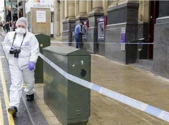 Forensic experts in Barnsley town centre after a stabbing on Saturday.