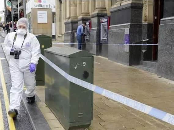 Forensic experts in Barnsley town centre after a stabbing on Saturday