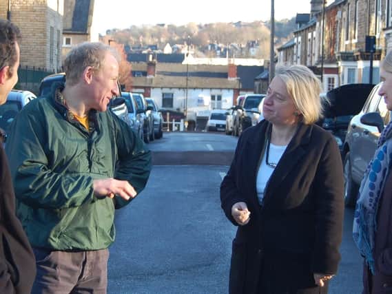 (l-r) Green Party campaigner Rob Unwin and resident David Thomas discussing the drains problem with Natalie Bennett and Coun Alison Teal.