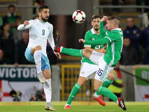 Israel's Moanes Dabour (left) and Northern Ireland's Oliver Norwood battle for the ball at Windsor Park, Belfast. Photo: Liam McBurney/PA Wire