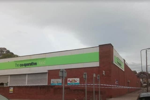 The Co-op in Swallownest is sealed off by the police this morning