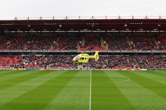 The air ambulance lands at Barnsley's Oakwell Stadium after a matchday volunteer had a cardiac arrest (pic: Barnsley FC)