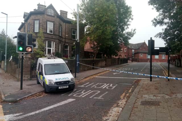 Police at the scene in Hillsborough, where two men were stabbed in the early hours of this morning