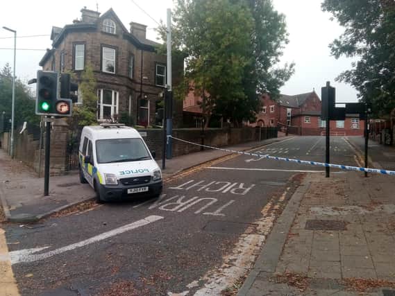 Police at the scene in Hillsborough, where two men were stabbed in the early hours of this morning