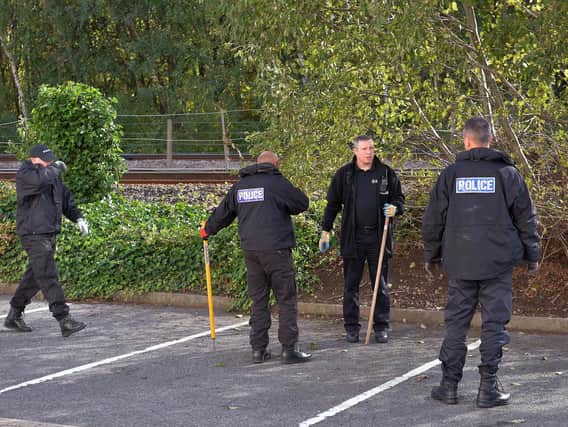 Police search the area around the edge of Valley Centertainment in Sheffield after a young man was fatally assaulted