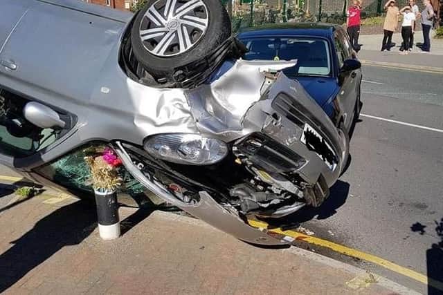 A car landed on its roof after a collision in Sheffield this afternoon