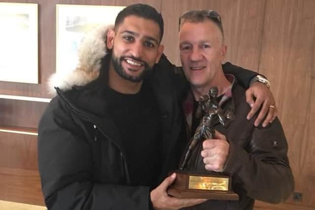 Glyn Rhodes with Amir Khan, in London, after receiving the trophy
