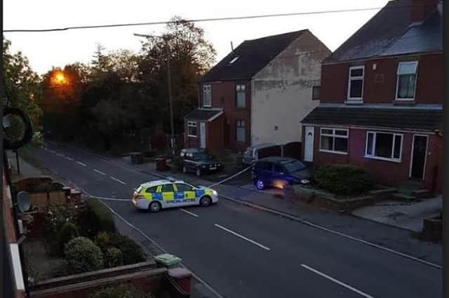 A road has been sealed off by the police following a shooting