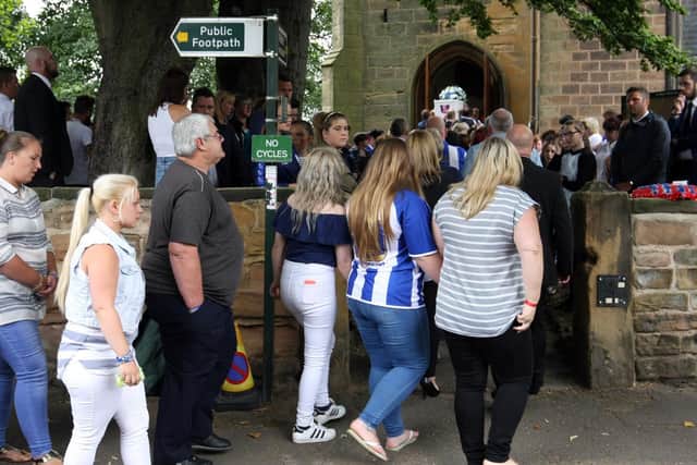 Mourners wore Sheffield Wednesday colours at the funeral.