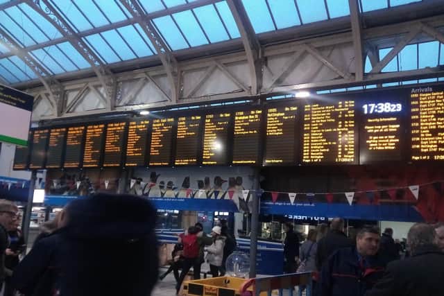 Commuters check the boards at Sheffield Station to see if their trains are on time