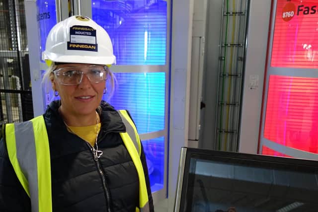 Boeing Sheffield facilities manager Marie Marriott with an automated loading system for machine tools.