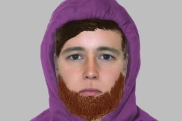 A police E-fit has been released of a man wanted over a shop raid in Barnsley