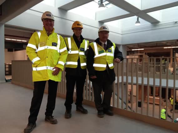 Henry Boot's Dave Woodhouse, the council's head of economic development Paul Clifford and Coun Roy Miller at Barnsley's new Market Hall