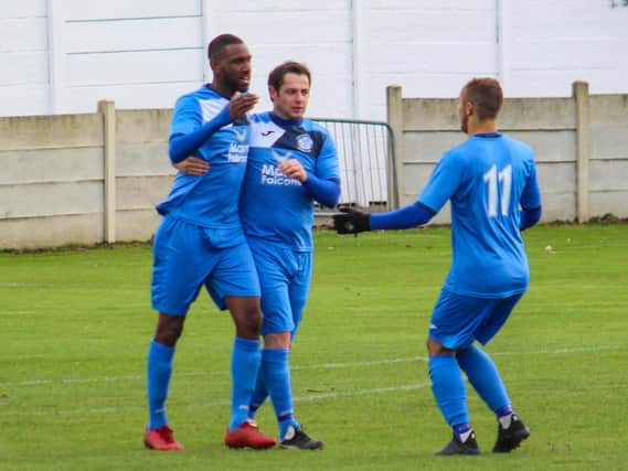 Darren Mansaram (left) is congratulated after giving Armthorpe  early lead in 4-1 win against Dronfield Town. Pic: Steve Pennock