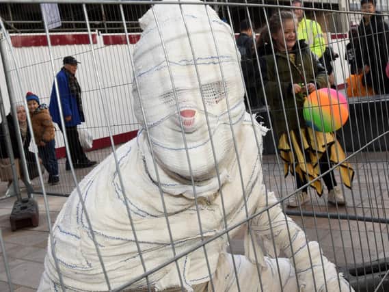 The caged mummy at the Little Monster's Halloween Party, which is part of the Out of this World festival.