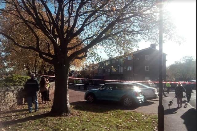 A cordon is in place around a block of flats where a blaze broke out this morning