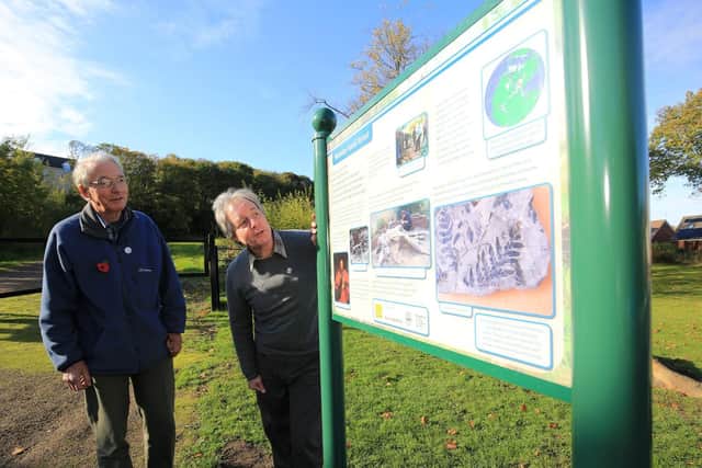 Peter Kennett and Duncan Hawley with the information board