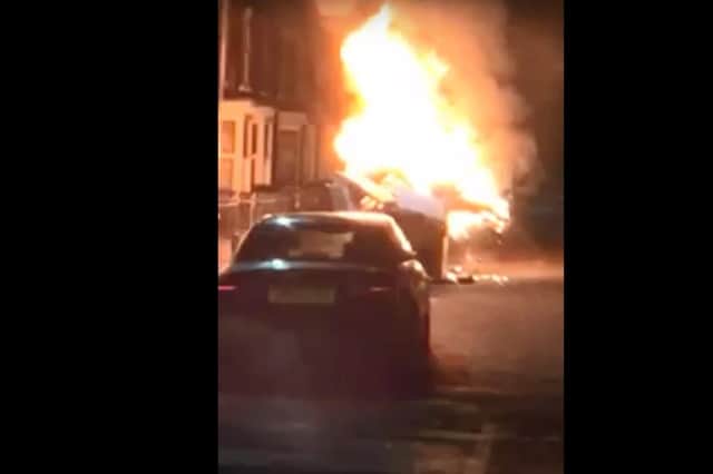 A skip went up in flames in the same street where firefighters were attacked with fireworks last week