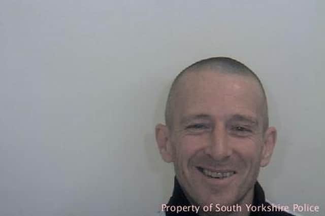 Jason Holland is wanted by South Yorkshire Police