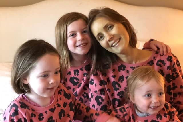 Jenny Walker and her three girls, six-year-old Nia, four-year-old Cora and one-year-old Beth.
