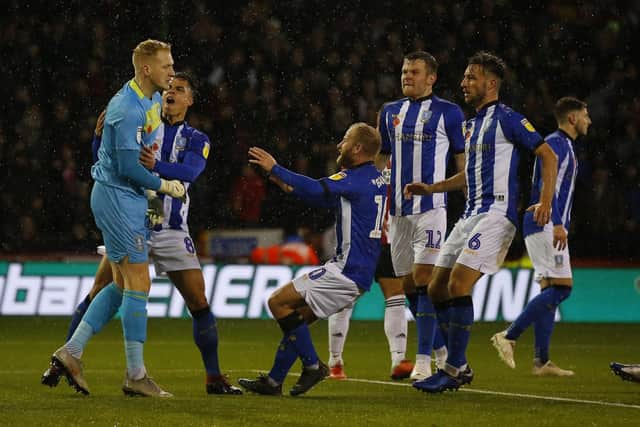 Cameron Dawson of Sheffield Wednesday in congratulated after saving a penalty. Simon Bellis/Sportimage.