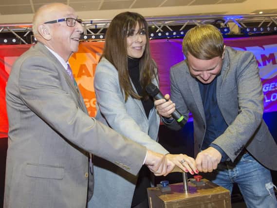 Coronation Street actress Kym Marsh switching on th Christmas lights at Crystal Peaks in Sheffield
Cllr Tony Downing, Kym Marsh and Simon Morikin push the plunger
