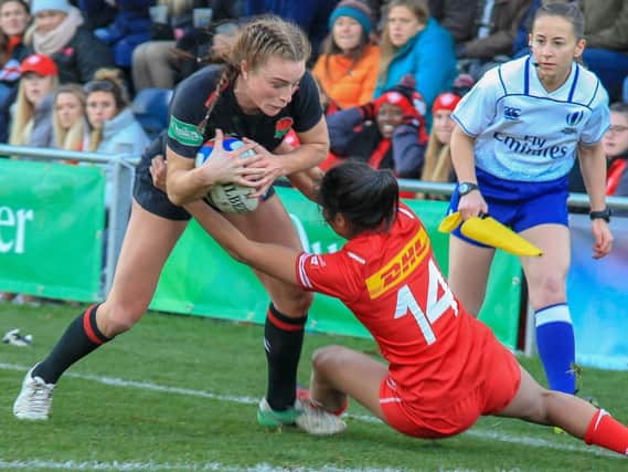 Action from England Women's win over Canada at Castle Park.