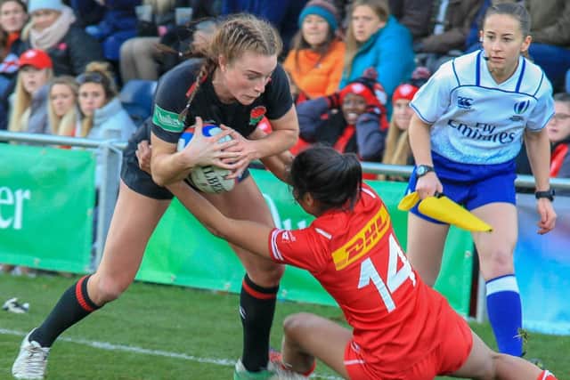 Action from England Women's win over Canada at Castle Park.