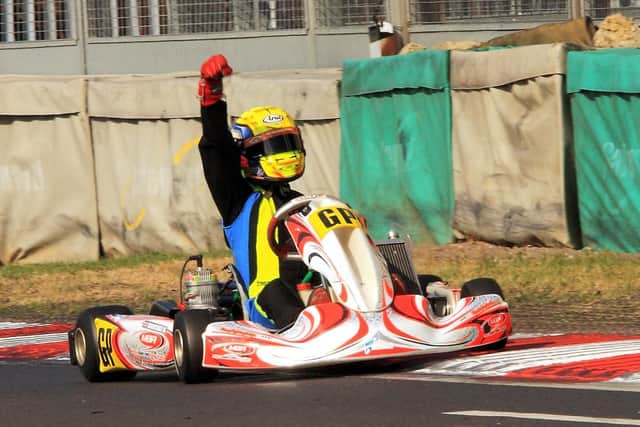 Ben Barnicoat punches the air to celebrate winning the Senior X30 GP and clinching his 7th Kartmasters GP victory.