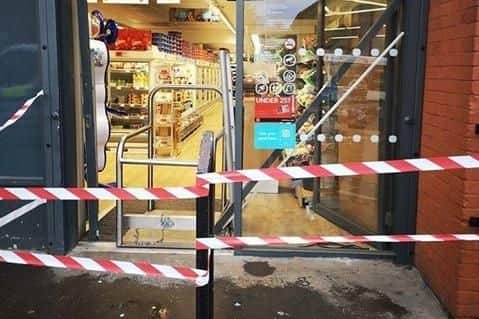 The entrance to the store was damaged in the break-in.
