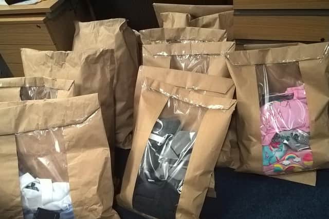 Items recovered during a raid of a suspected shoplifter's house in Sheffield