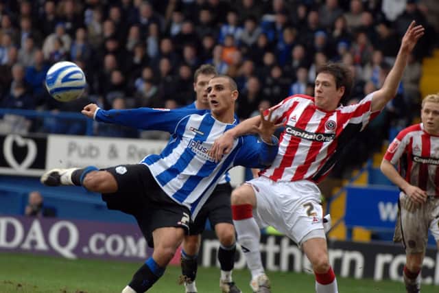 Marcus Tudgay keeps his eye on the ball as he scores the second goal for Wednesday under pressure from United's Leigh Bromby. PICTURE GERARD BINKS