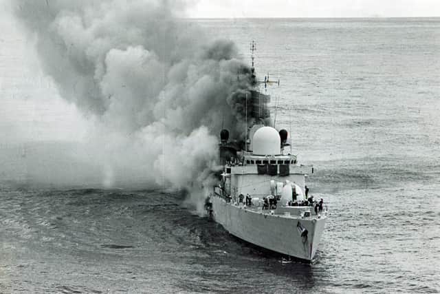 Smoke pours from the HMS Sheffield after the deadly missile strike during the Falklands War